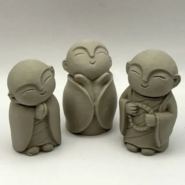 Three Monk Figurines